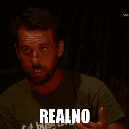 a man with a beard wearing a green shirt that says realno on it