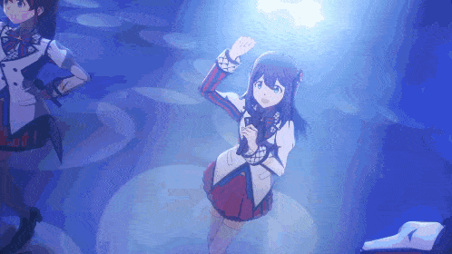 a girl in a red and white dress is dancing in a dark room