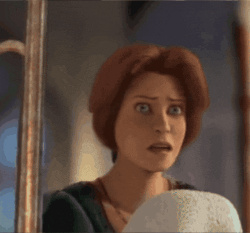 a close up of a cartoon character 's face with a surprised look on her face