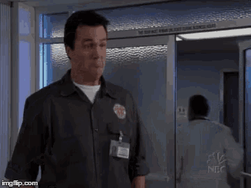 a man in a uniform is standing in front of a door that says " do not enter "
