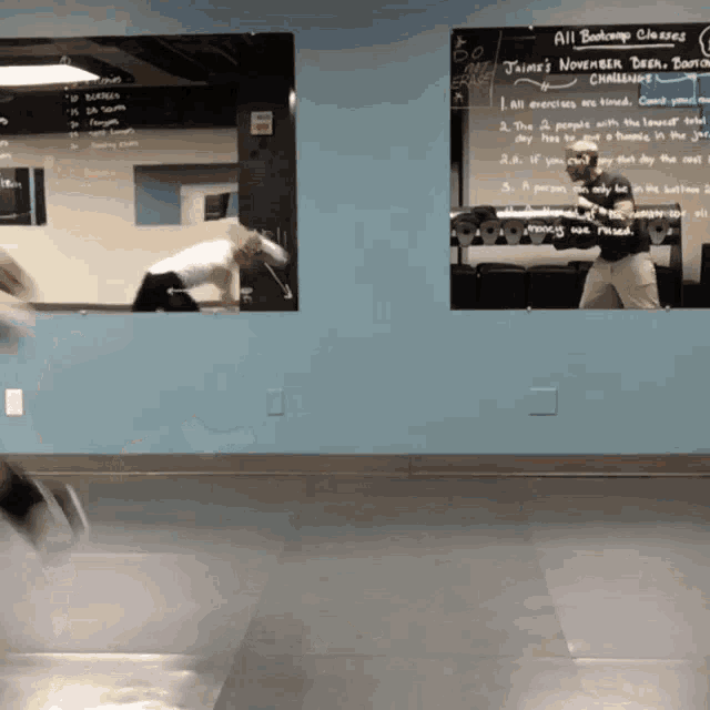 a gym with a chalkboard that says all bootcamp classes