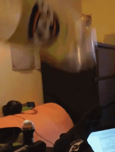 a person laying on a bed with their feet up and a laptop in front of them