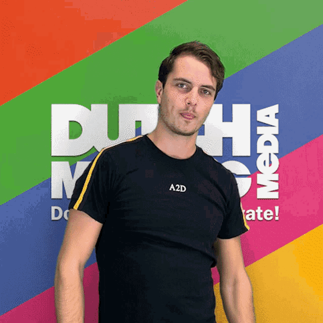 a man wearing a black shirt with a2d on the front