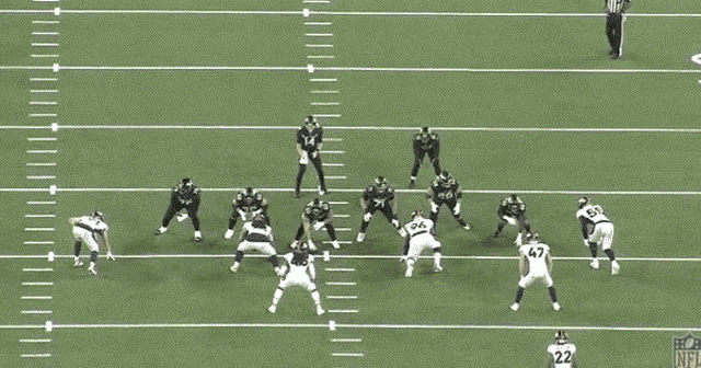 a football game is being played on a field with the nfl logo on the sidelines