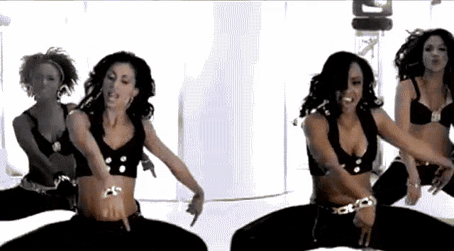 a group of women are dancing in a room with a white background