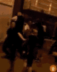 a blurry image of a person standing in the dark
