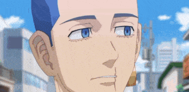 a close up of a person 's face with blue eyes and a shaved head .