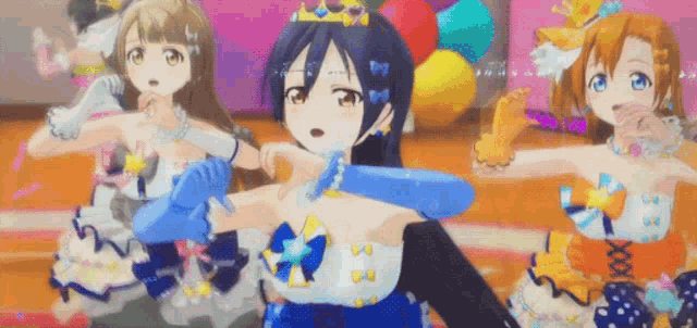 a group of anime girls are dancing on a stage with balloons in the background