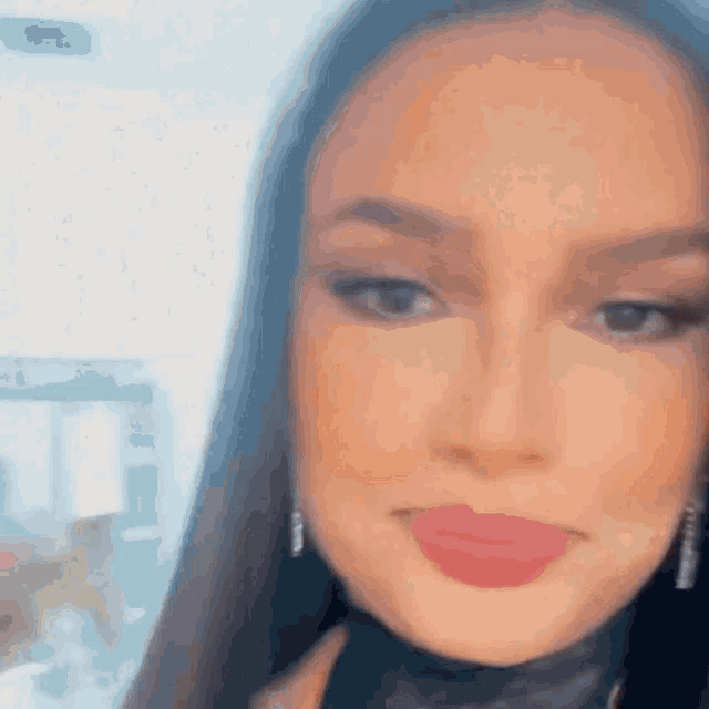 a blurry picture of a woman with red lips