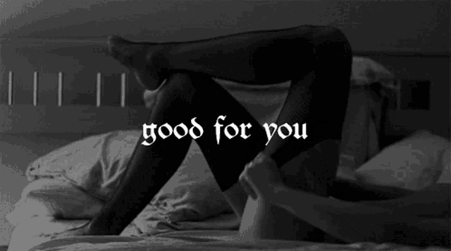 a black and white photo of a woman on a bed with the words good for you
