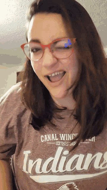 a woman wearing glasses and a canal winchester indians shirt