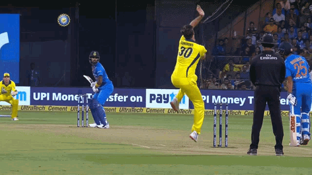 a cricket player with the number 30 on his shirt