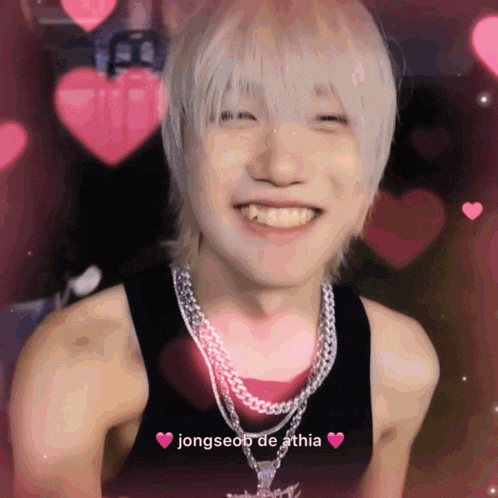 a young man wearing a tank top and a necklace with the name jongseop de athia on the bottom right