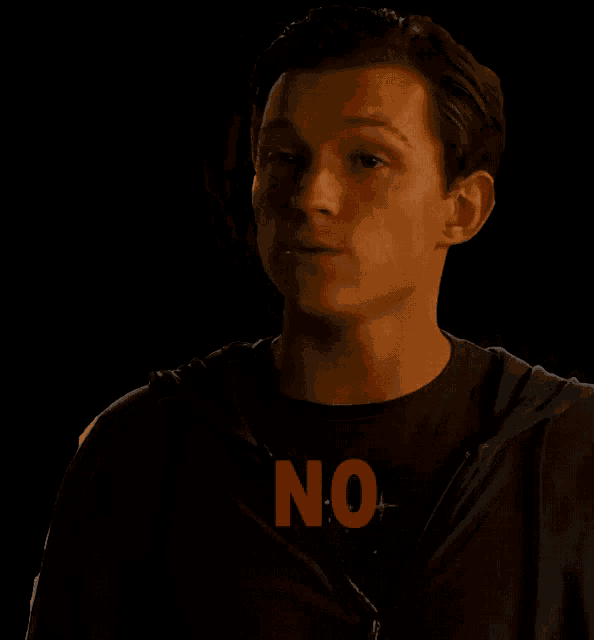 a man is wearing a black shirt that says no