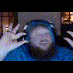 a man with a beard wearing headphones and a blue shirt