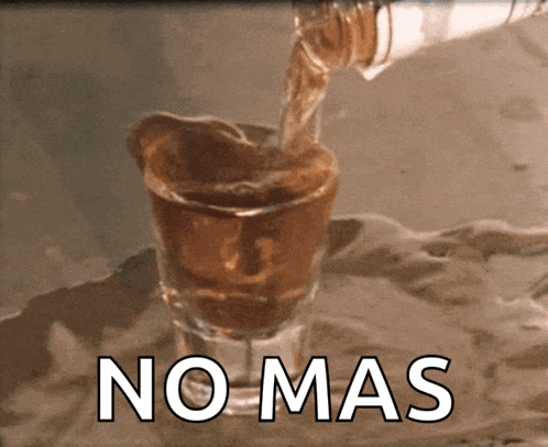 a shot glass with the word no mas written on the bottom