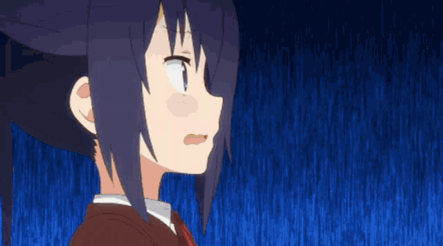 a close up of a girl 's face with a blue background