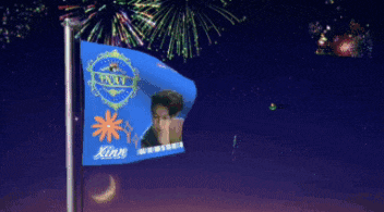 a blue flag with a picture of a man on it and the name xinn on it