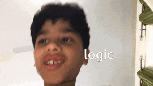 a young boy making a funny face with the word logic below him