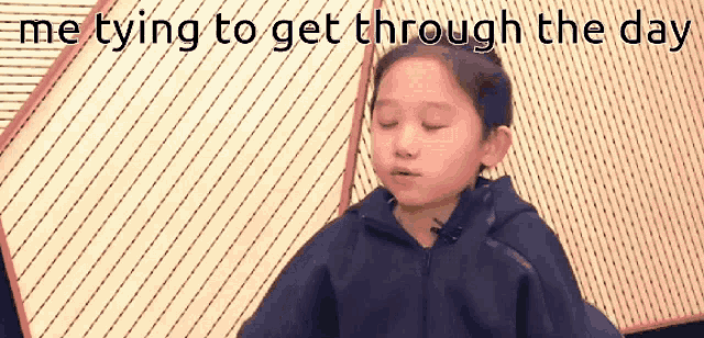 a little girl with her eyes closed and the words me trying to get through the day