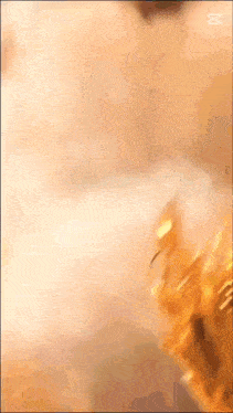 a close up of a gold ring with the letter m visible