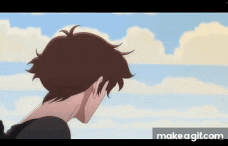 a boy with brown hair is standing in front of a cloudy sky .