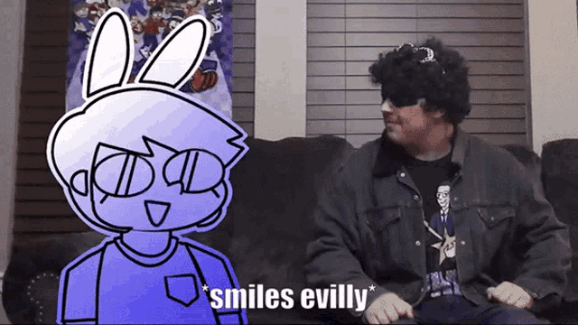 a man sitting on a couch with a cartoon character behind him that says * smiles evilly*