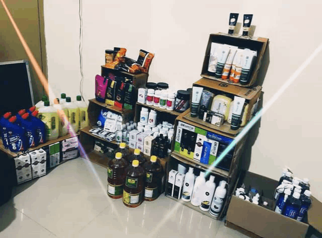 a shelf full of various bottles and boxes including one that says ' ayurvedic ' on it