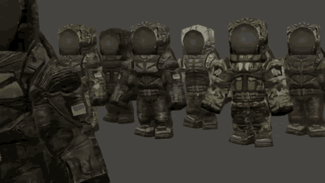 a group of soldiers are standing next to each other and one of them has the letter t on his back