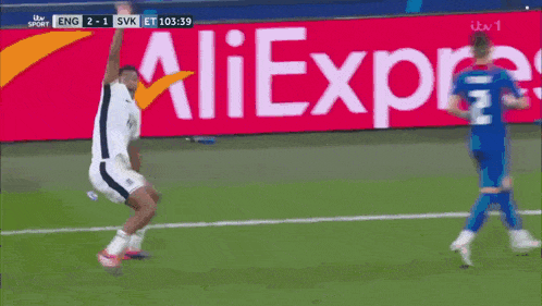 a soccer player is jumping in the air during a game