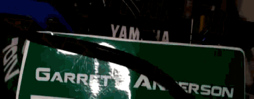 a green garrett anderson box with a black cord