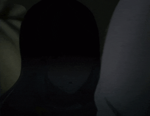 a girl with a surprised look on her face is standing next to a person