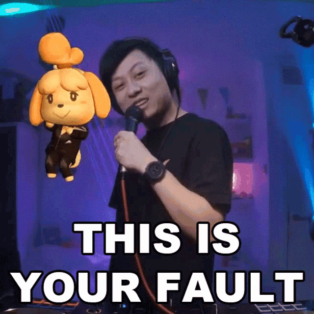 a man singing into a microphone with a stuffed animal behind him that says this is your fault