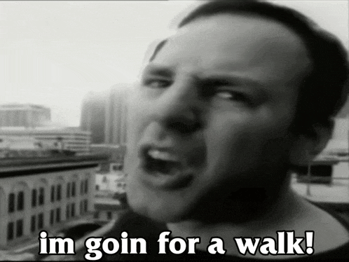 a man says " im goin for a walk " in front of a city