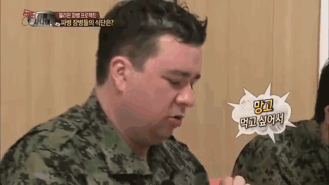 a man in a military uniform with a speech bubble that says ' i 'm hungry '