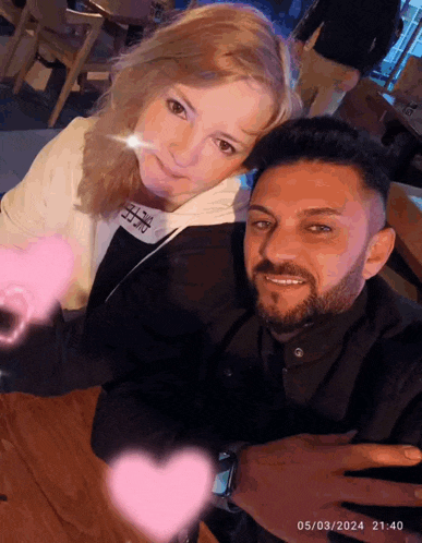 a man and a woman are posing for a picture with the date 05/03/2024 at the bottom