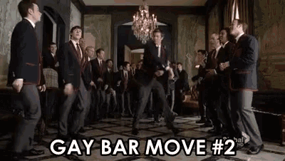 a group of men in suits and ties are dancing in a room with the words gay bar move # 2 written above them .