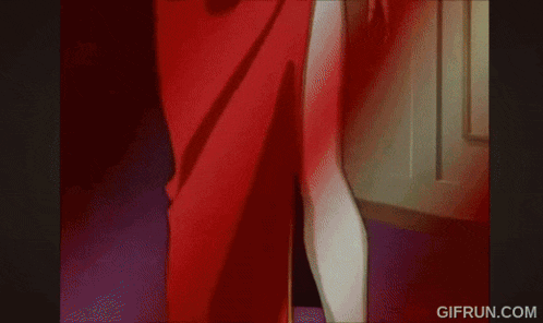 a woman in a red skirt with a blue sash around her waist is standing next to a door .
