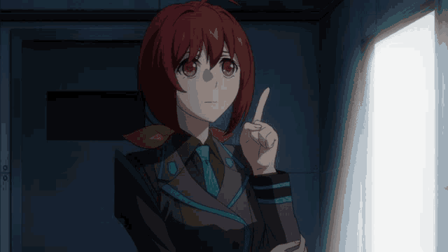 a girl with red hair is pointing at something in a dark room