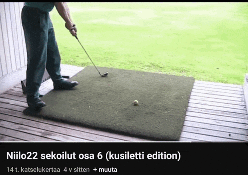 a man is swinging a golf club on a mat that says niilo22 sekolut osa 6