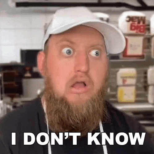 a man with a beard is wearing a white hat and apron and says i don 't know