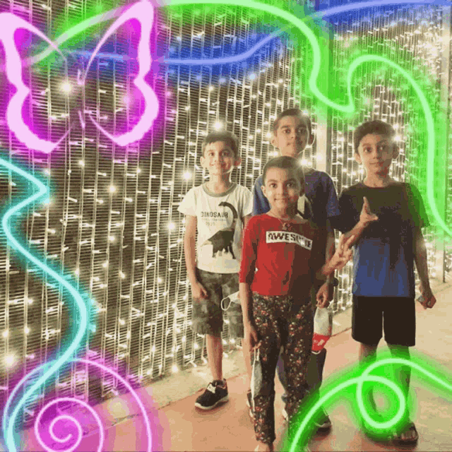 a boy wearing a shirt that says awesome stands in front of a neon butterfly