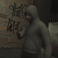 a man in a hooded sweatshirt is standing in front of a brick wall with graffiti on it .