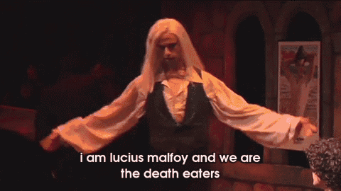 a man in a black vest and white shirt says " i am lucius malfoy and we are the death eaters "