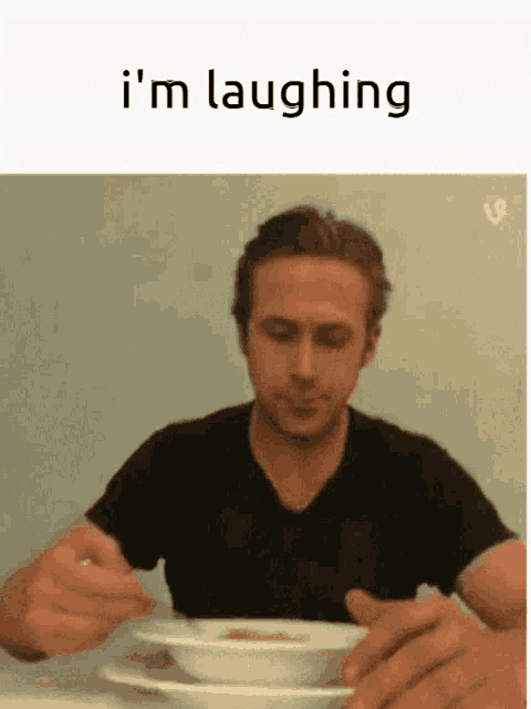 a man sitting at a table with a bowl of soup and the words i 'm laughing above him