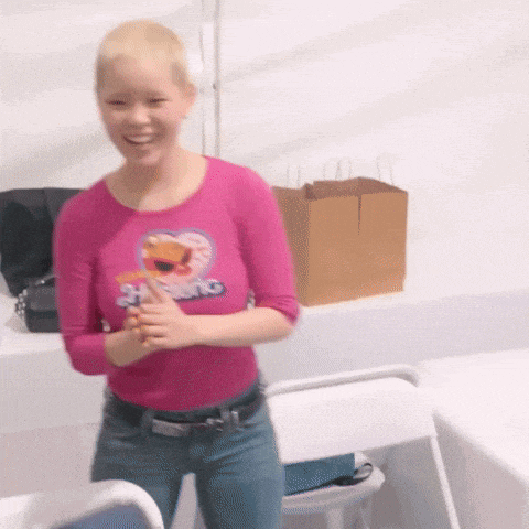 a woman wearing a pink shirt that says 24 swing on it