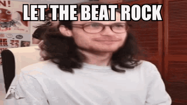 a man wearing glasses and a white shirt with the words let the beat rock on his face