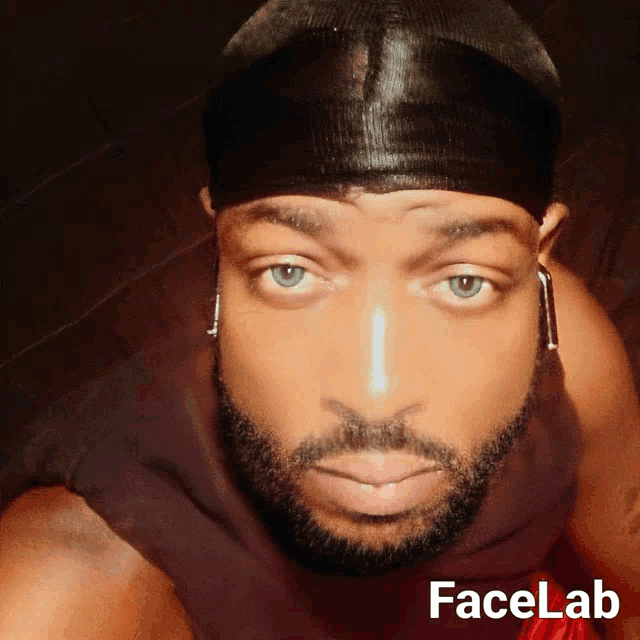 a close up of a man 's face with the words facelab below him