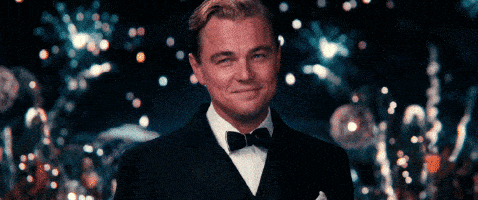 a man in a tuxedo with a bow tie smiles