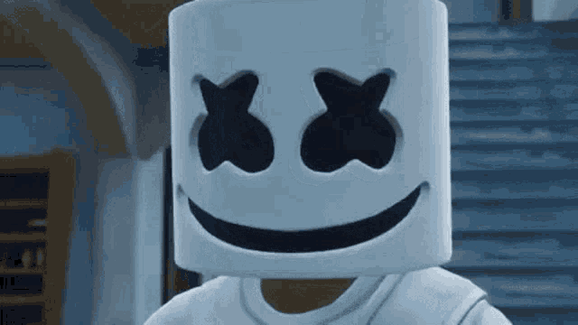 a close up of a marshmallow with crossed eyes and a smiling face .